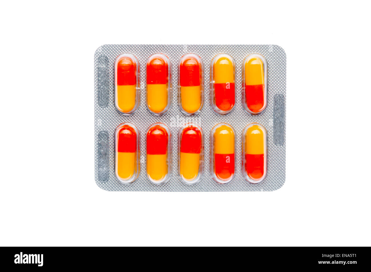 Die orangenen Pillen in einem Blister auf isolierte Hintergrund Stockfoto