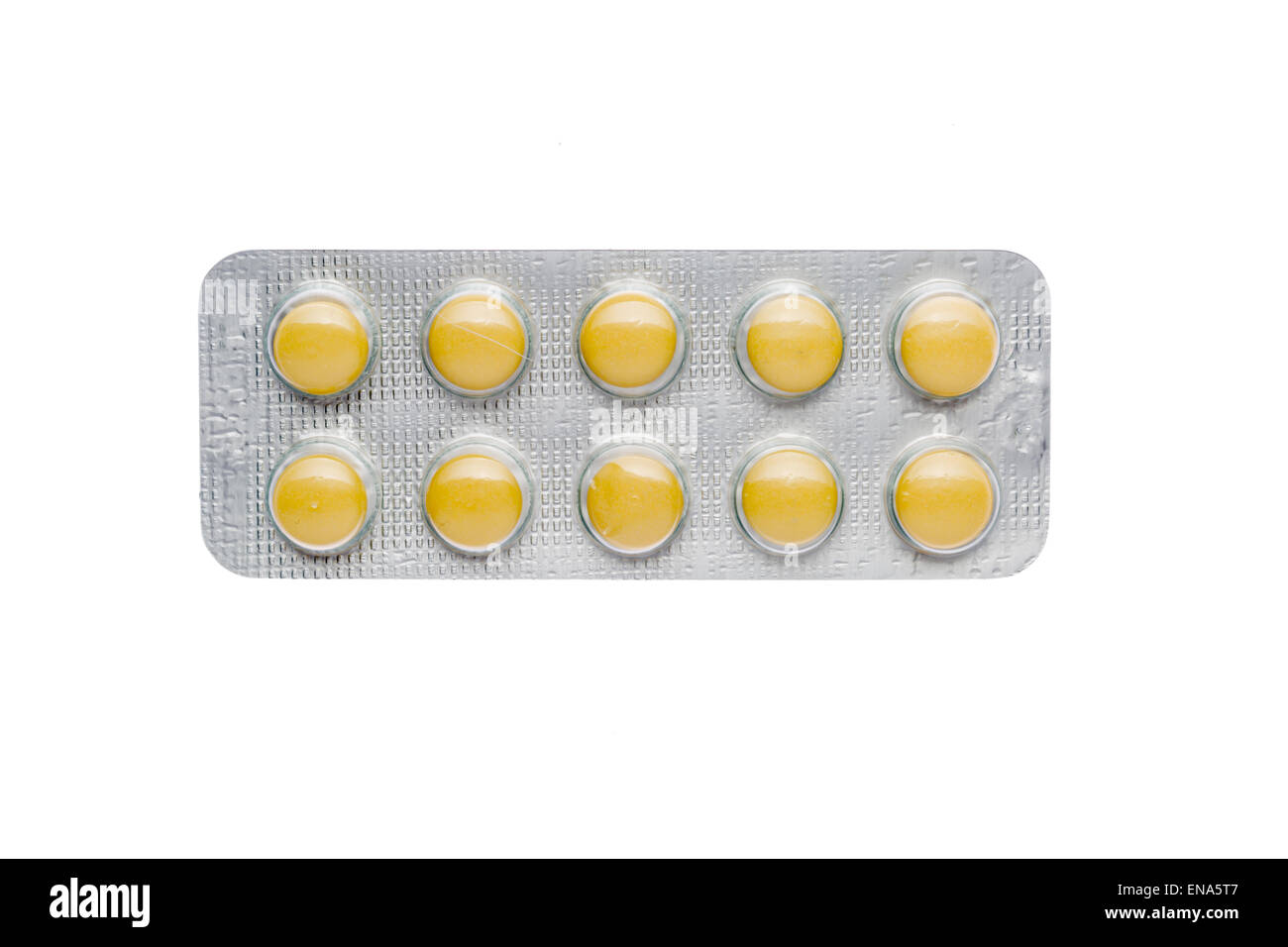 Die gelben Pillen in einem Blister auf isolierte Hintergrund Stockfoto