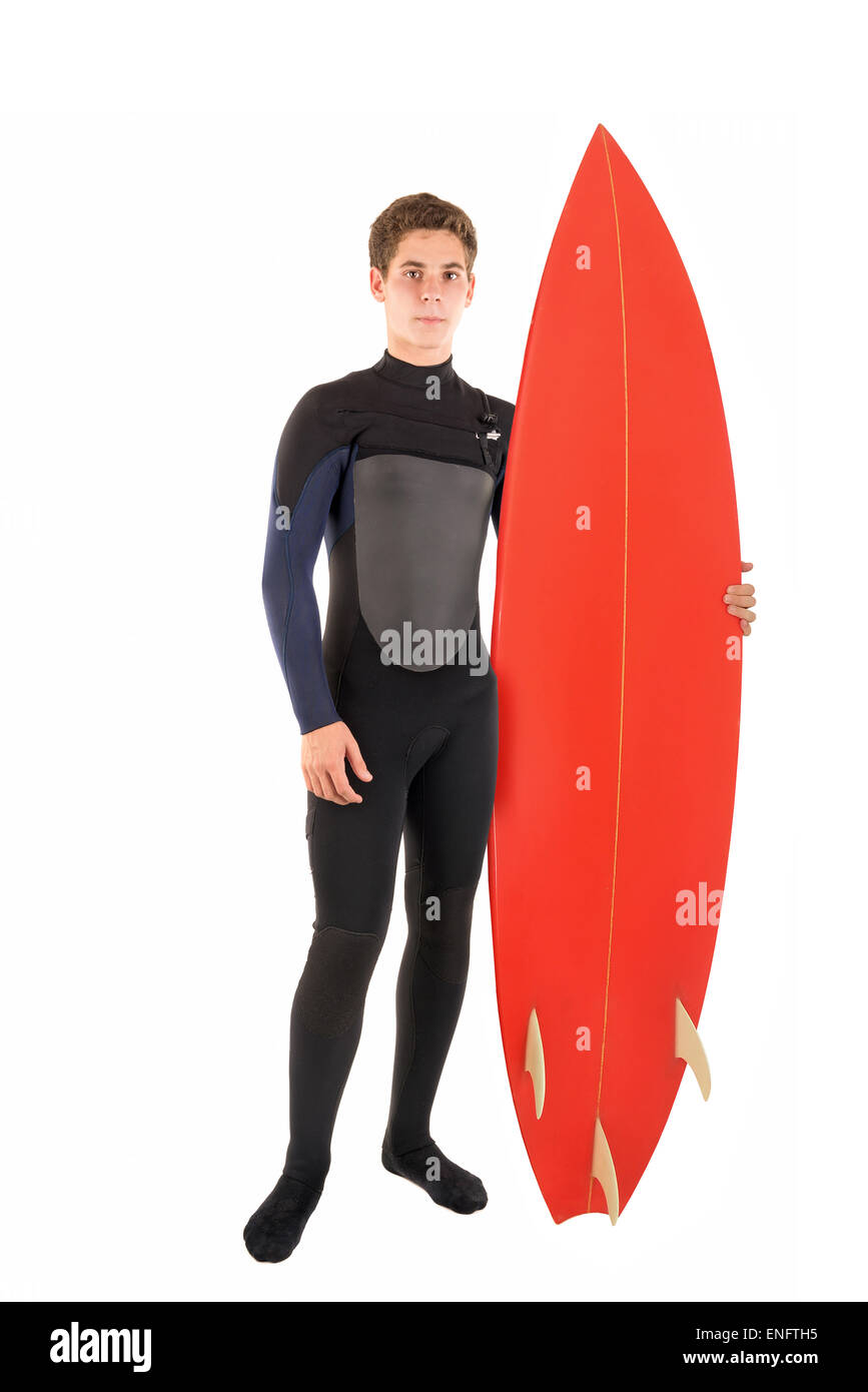 Teenager im Neoprenanzug mit Surf Board posiert isoliert in weiß Stockfoto