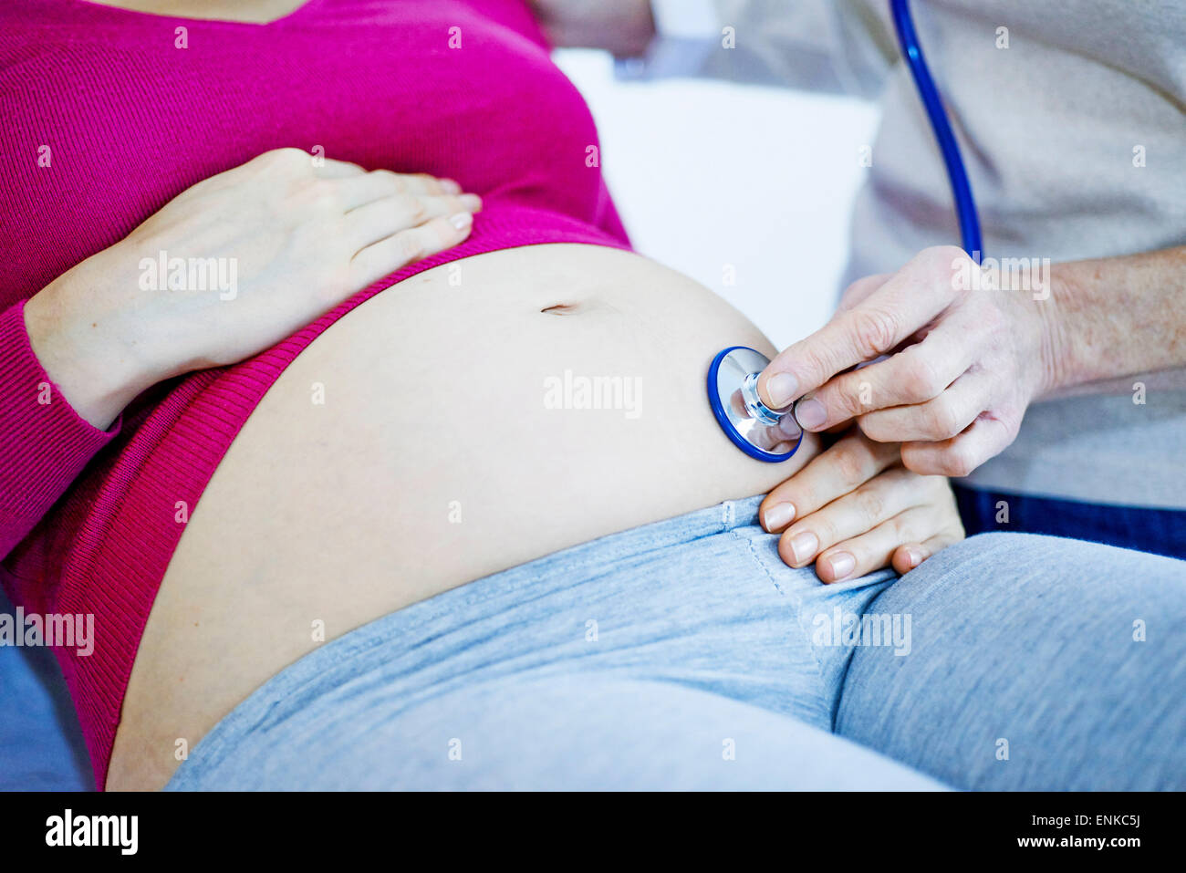Schwangere Frau in Absprache Stockfoto
