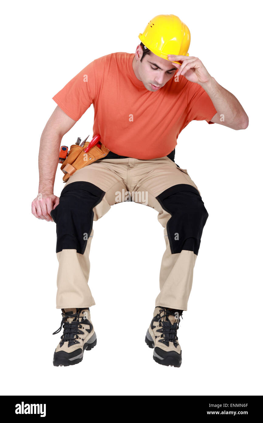 Arbeiter von Leiste herabstarren Stockfoto