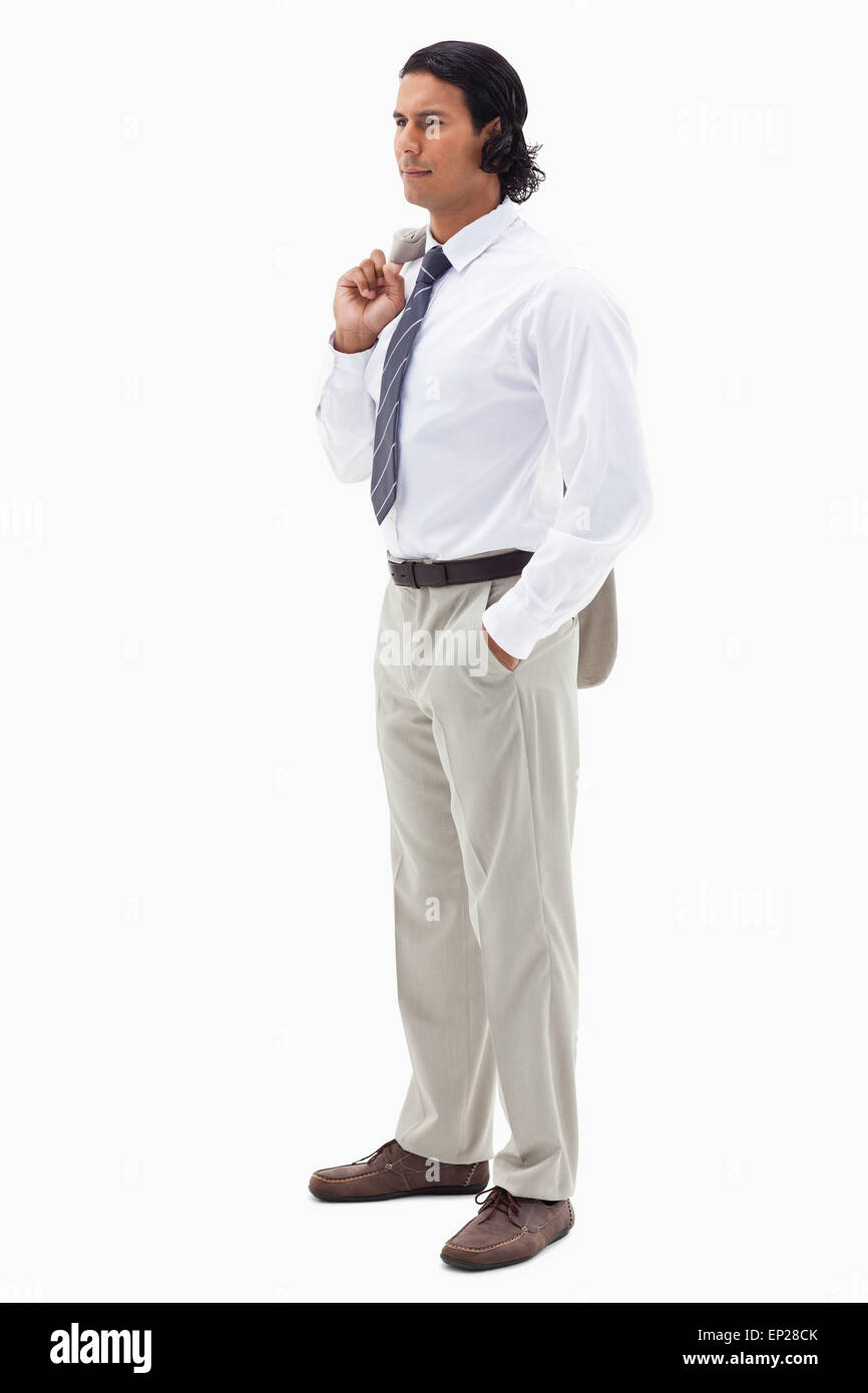 Porträt von eine ernsthafte Büroangestellte hält seine Jacke über die Schulter Stockfoto