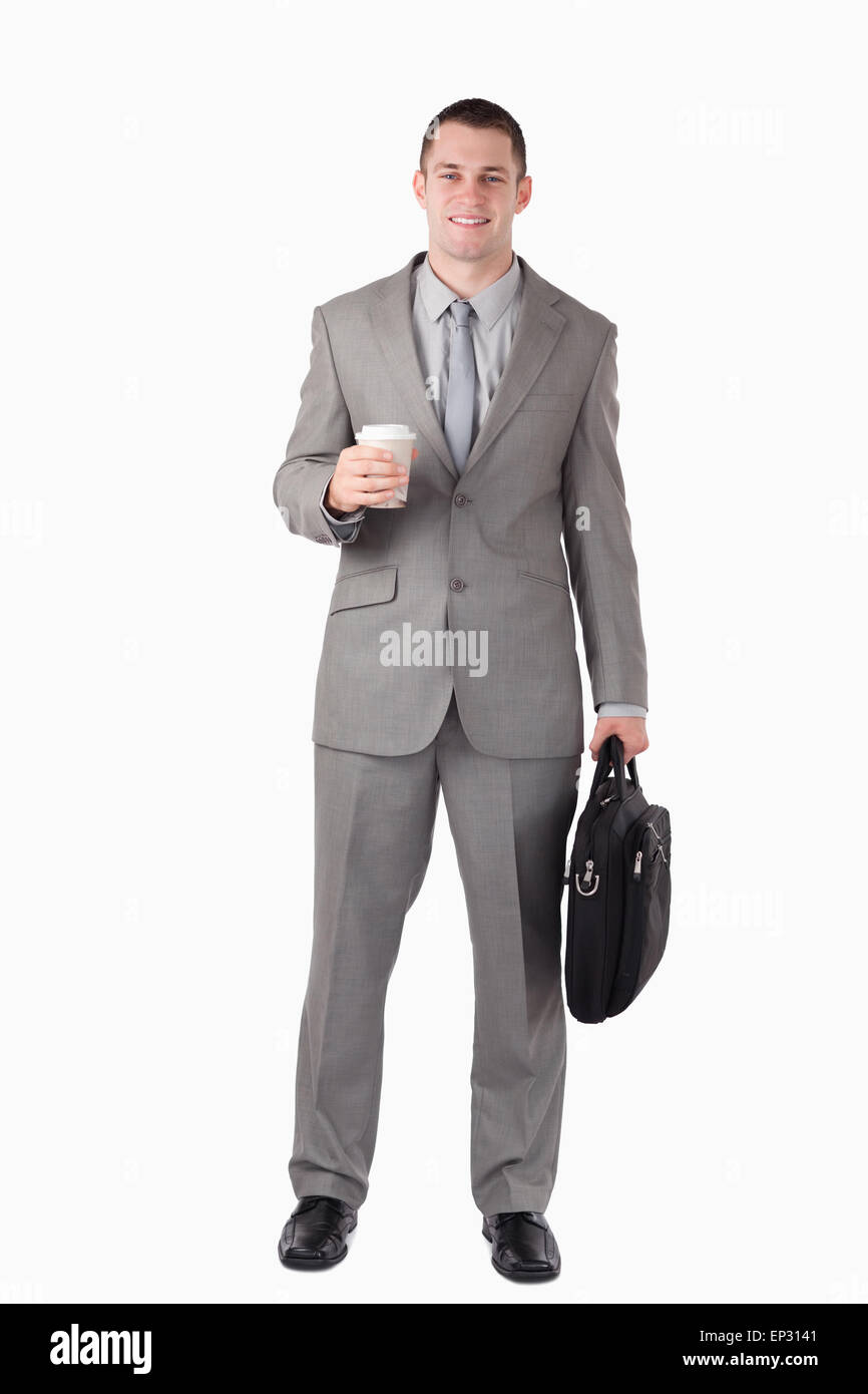 Porträt eines Geschäftsmannes hält eine Tasse Kaffee und einem computer Stockfoto