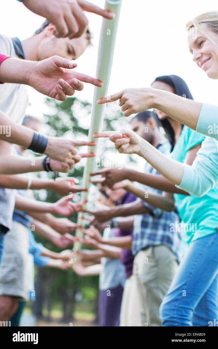 Team ausgleichenden Pol Fingerspitze Stockfoto