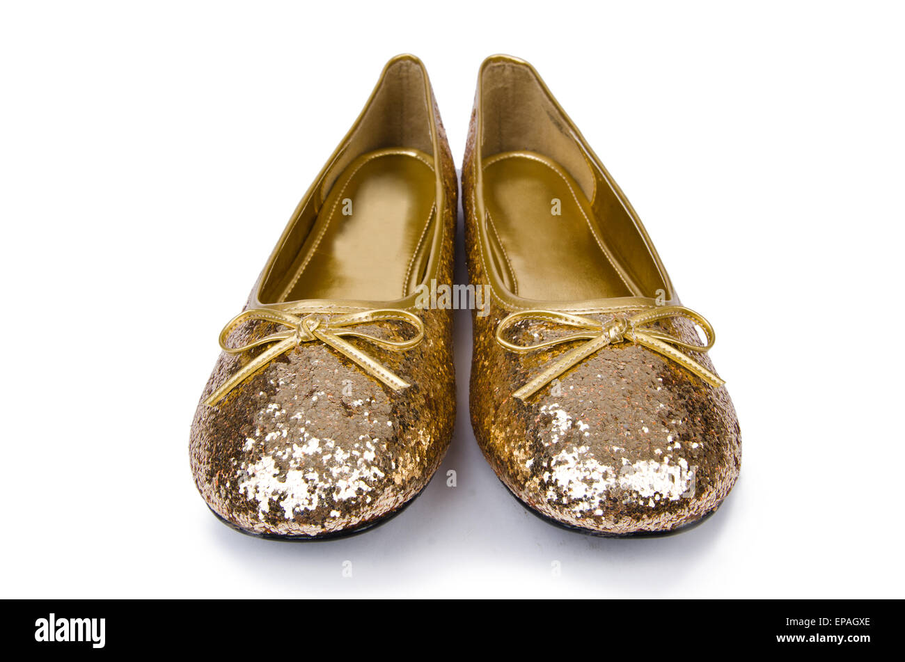 Goldene Ballettschuhe isoliert auf weiss Stockfoto