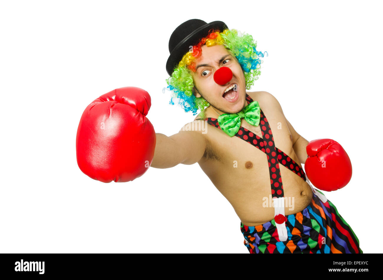 Clown mit Boxhandschuhen isoliert auf dem weißen Stockfoto