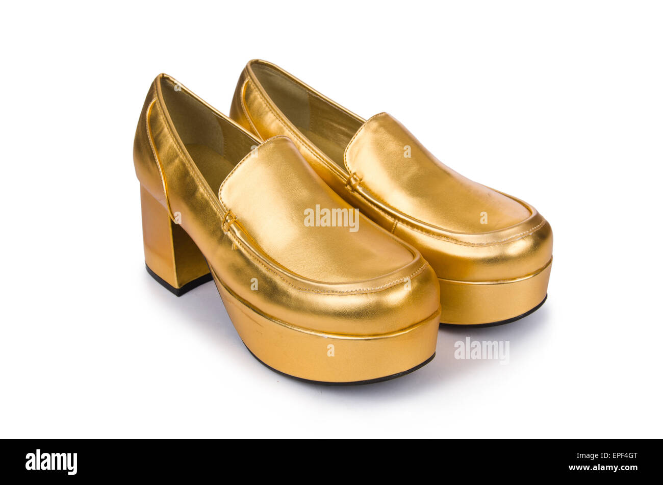 Goldene Frau Schuhe isoliert auf dem weißen Stockfoto