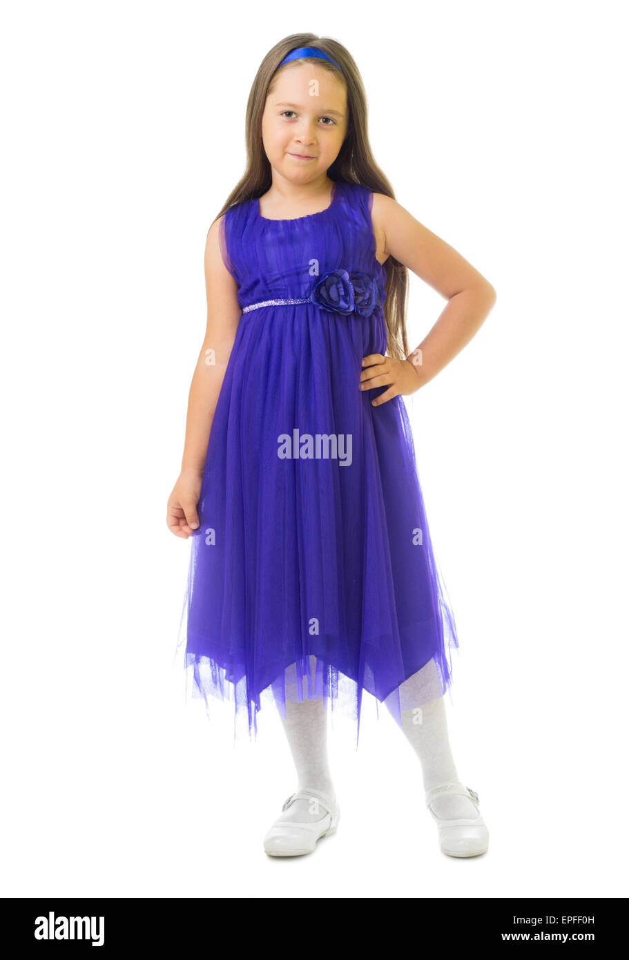 Kleines Mädchen im blauen Kleid isoliert Stockfoto
