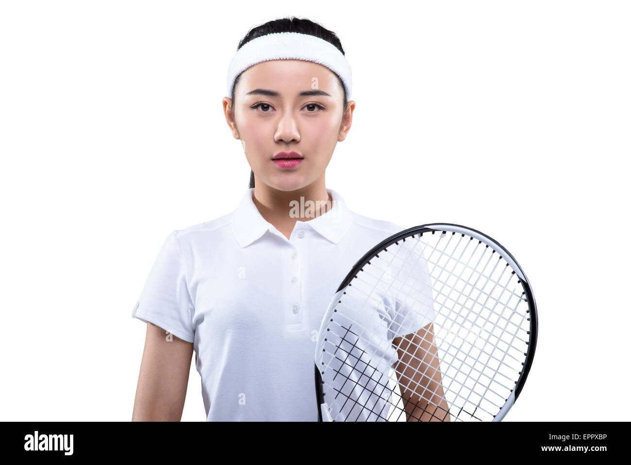 Junge Frau in Tennis-Outfit mit Schläger Stockfoto
