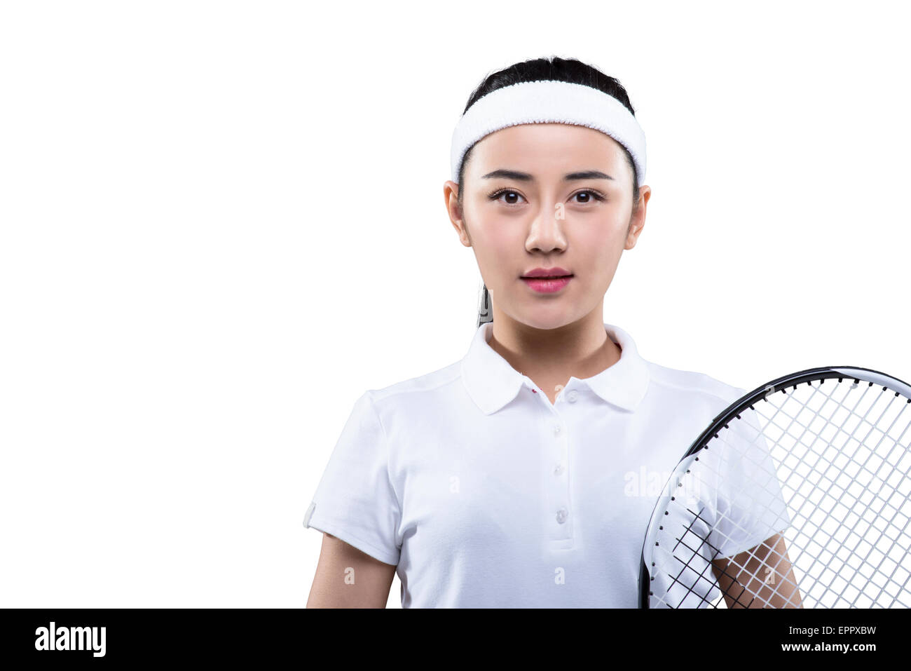 Junge Frau in Tennis-Outfit mit Schläger Stockfoto