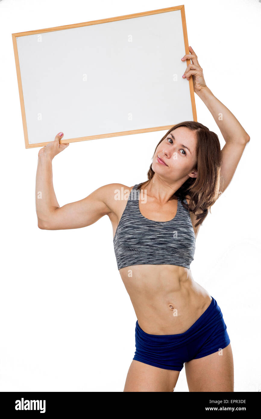weibliche Bodybuilder hält ein leeres Whiteboard bereit für Ihre eigene Nachricht Model-Release verfügbar Stockfoto