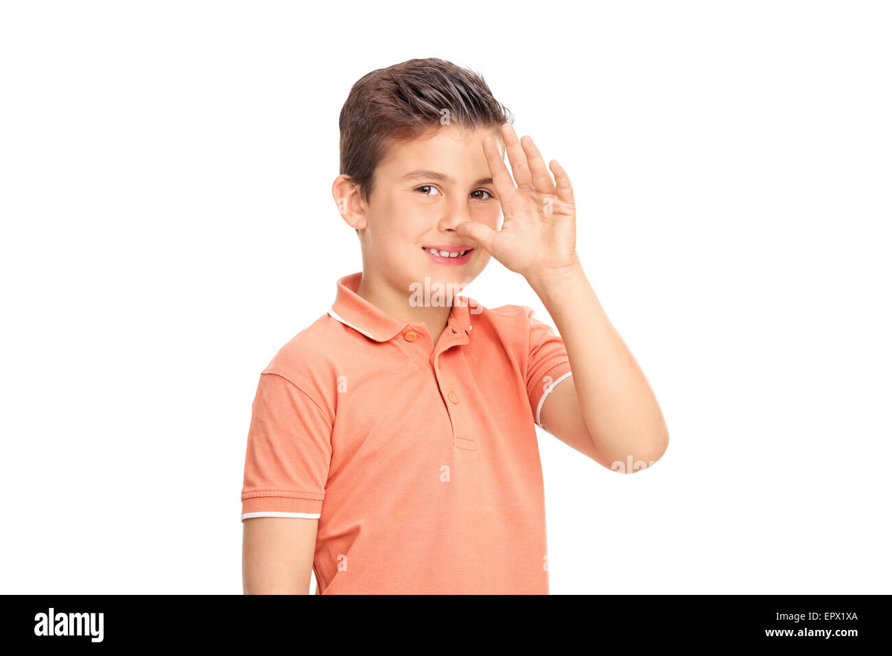 Dummer kleiner Junge eine kindliche Hand Geste und schaut in die Kamera, die isoliert auf weißem Hintergrund Stockfoto