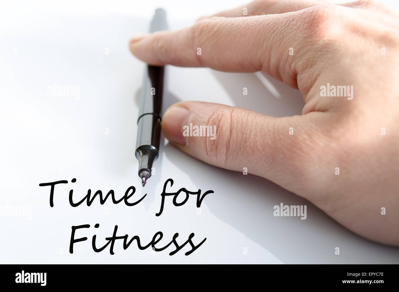 Stift in der Hand isoliert auf weißem Hintergrund Zeit für Fitness-Konzept Stockfoto