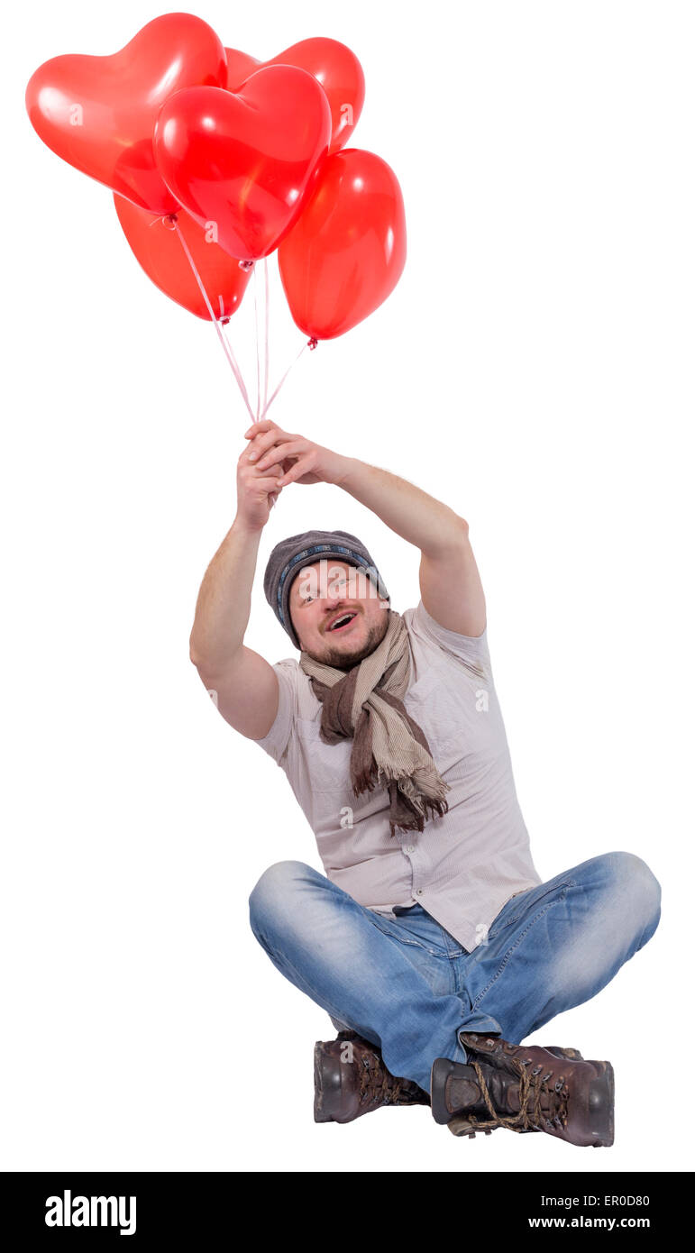 Junger Mann fliegen auf Ballons auf weißen Hintergrund isoliert Stockfoto