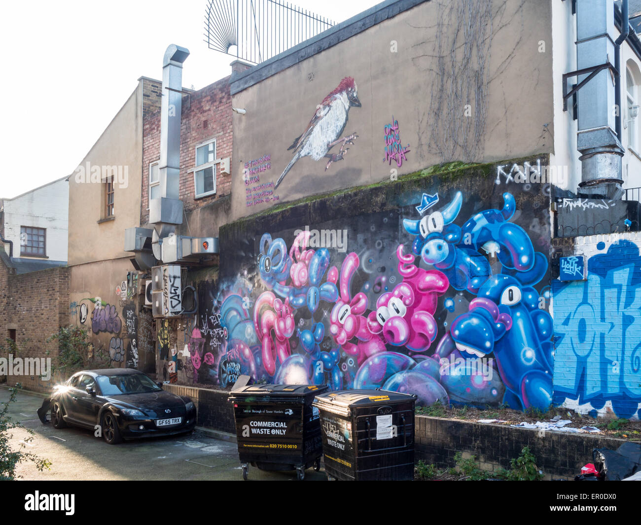 Graffiti in den Gebäudewänden der Gegend Brick Lane, London Stockfoto