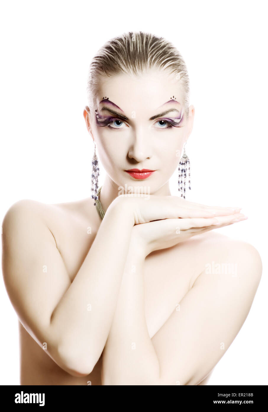 Schöne junge Frau mit kreativen Make-up im Gesicht Stockfoto