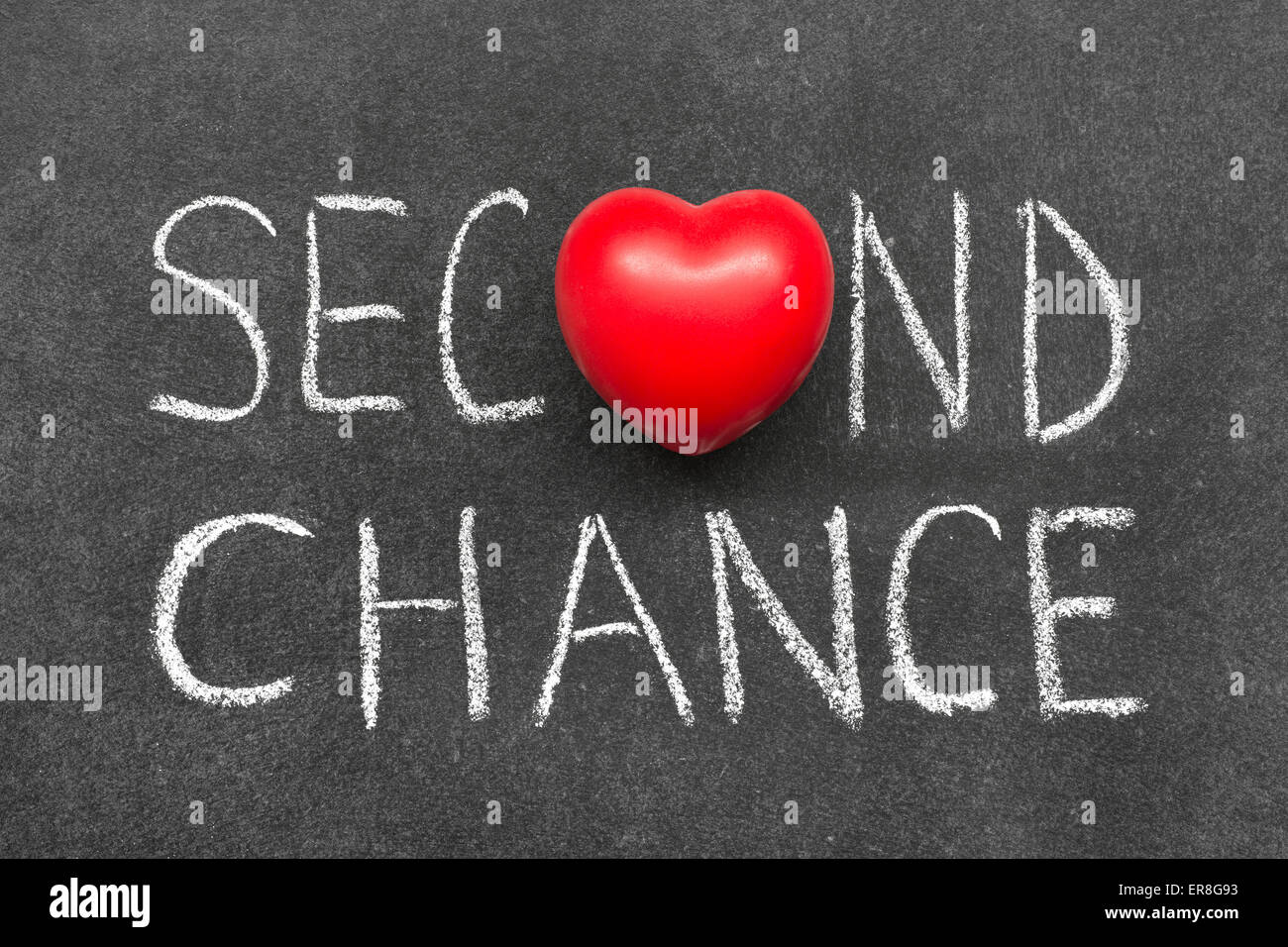 zweite Chance-Satz handschriftlich auf Tafel mit Herzsymbol statt O Stockfoto