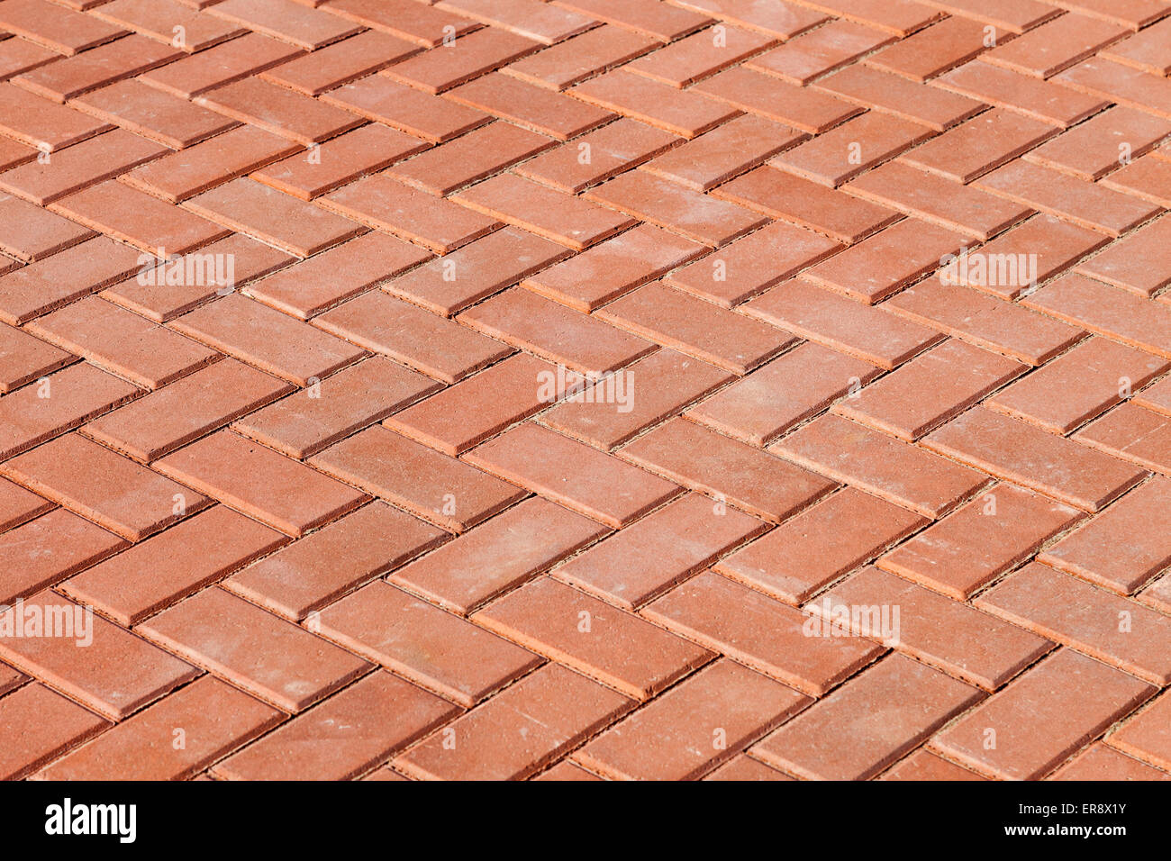 Rote Pflastersteine als Hintergrund Stockfoto