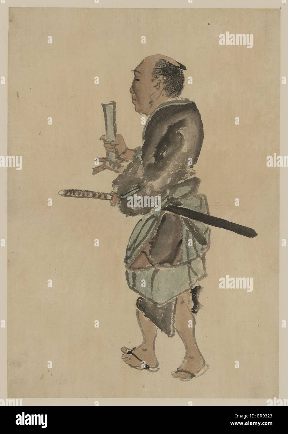 Mann mit einem Schwert zu Fuß in Richtung der linken Seite Stockfoto