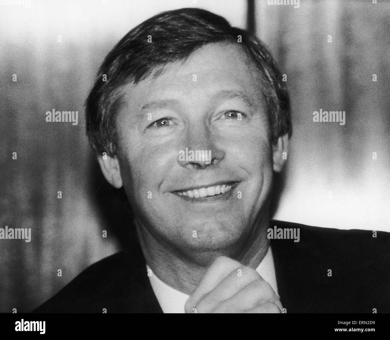 Neue Manchester United Manager Alex Ferguson lächelt nach seiner Ernennung im Old Trafford. November 1986. Stockfoto