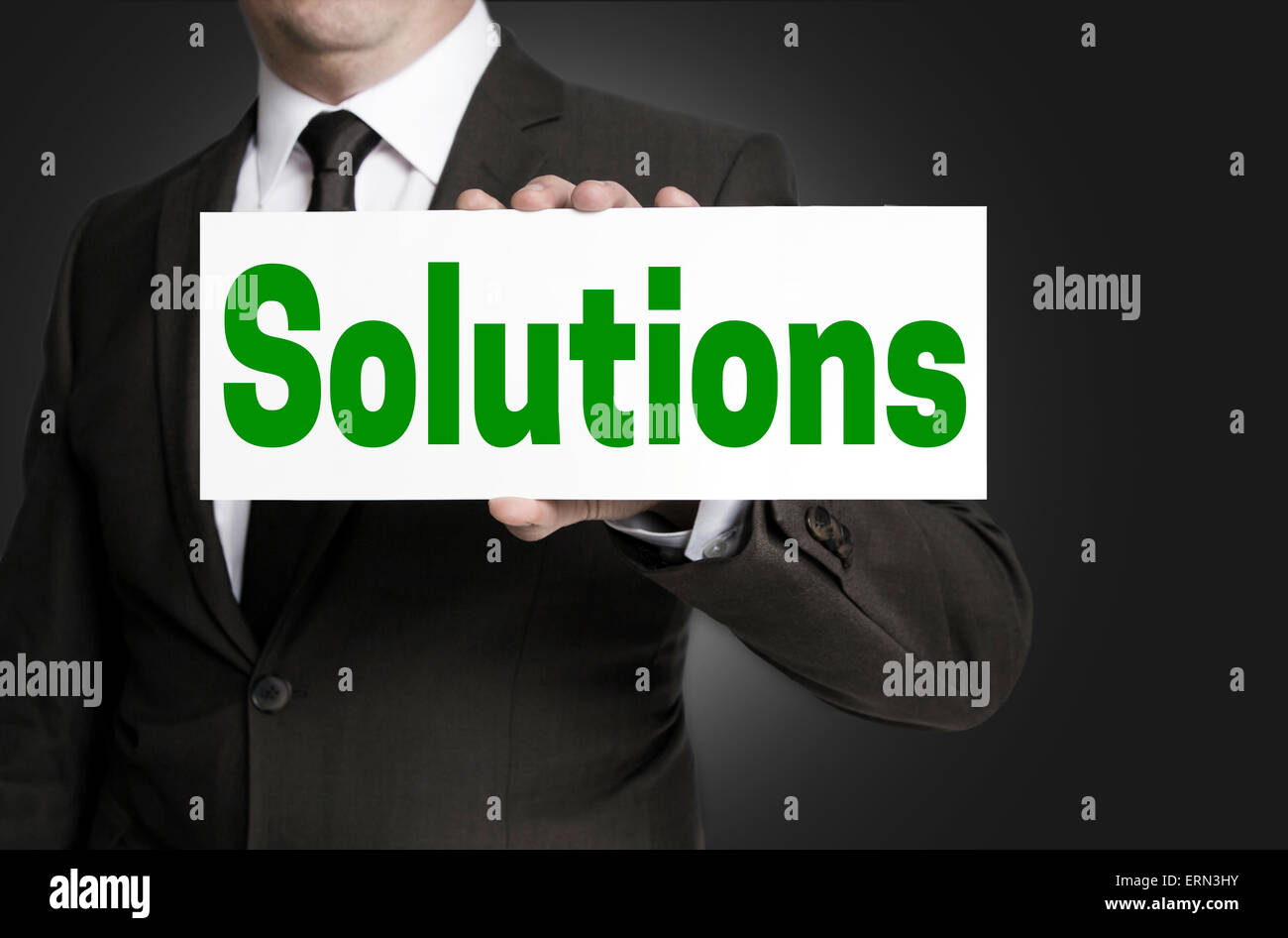 Lösungen-Zeichen werden durch Geschäftsmann gehalten. Stockfoto