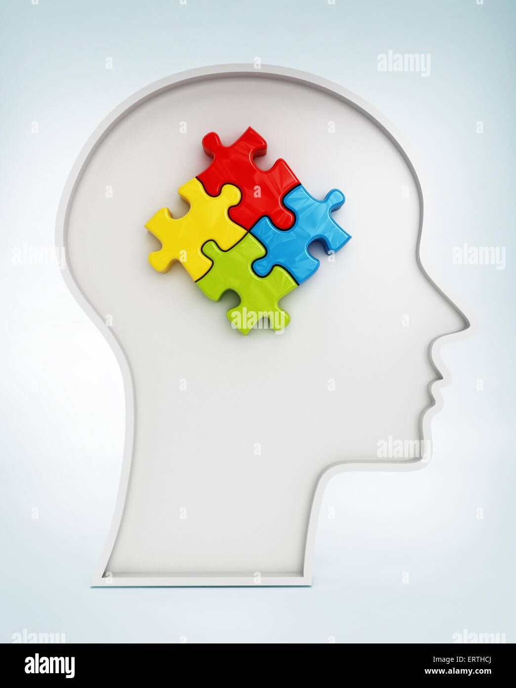 Vier farbige Jigsaw Puzzle-Teile im Inneren menschlichen Kopfform Stockfoto