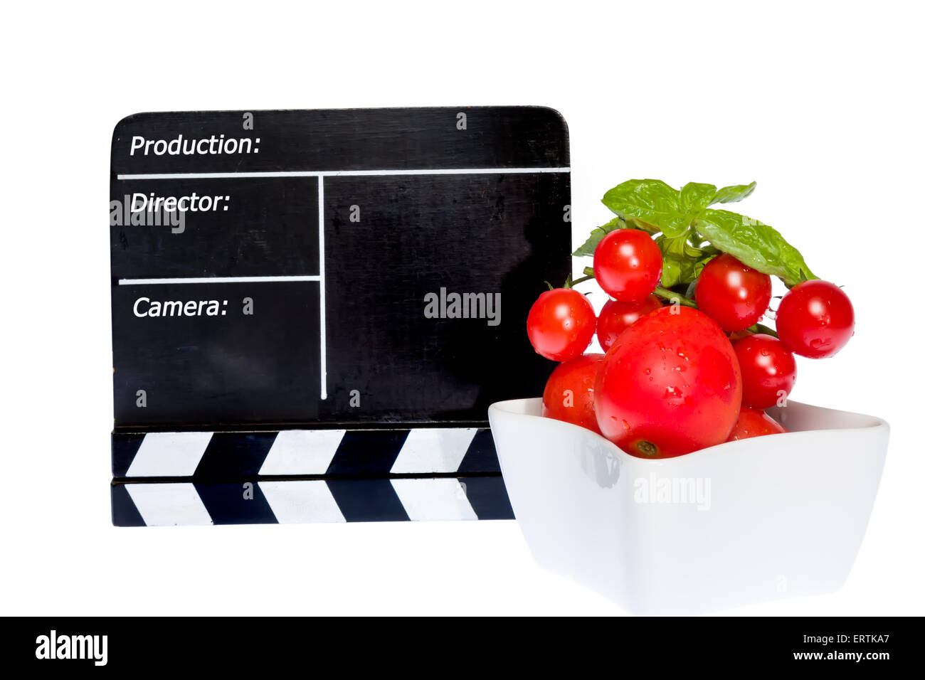 Tomaten-Geschichte - Tomaten und Film Klappe auf der Bühne Stockfoto