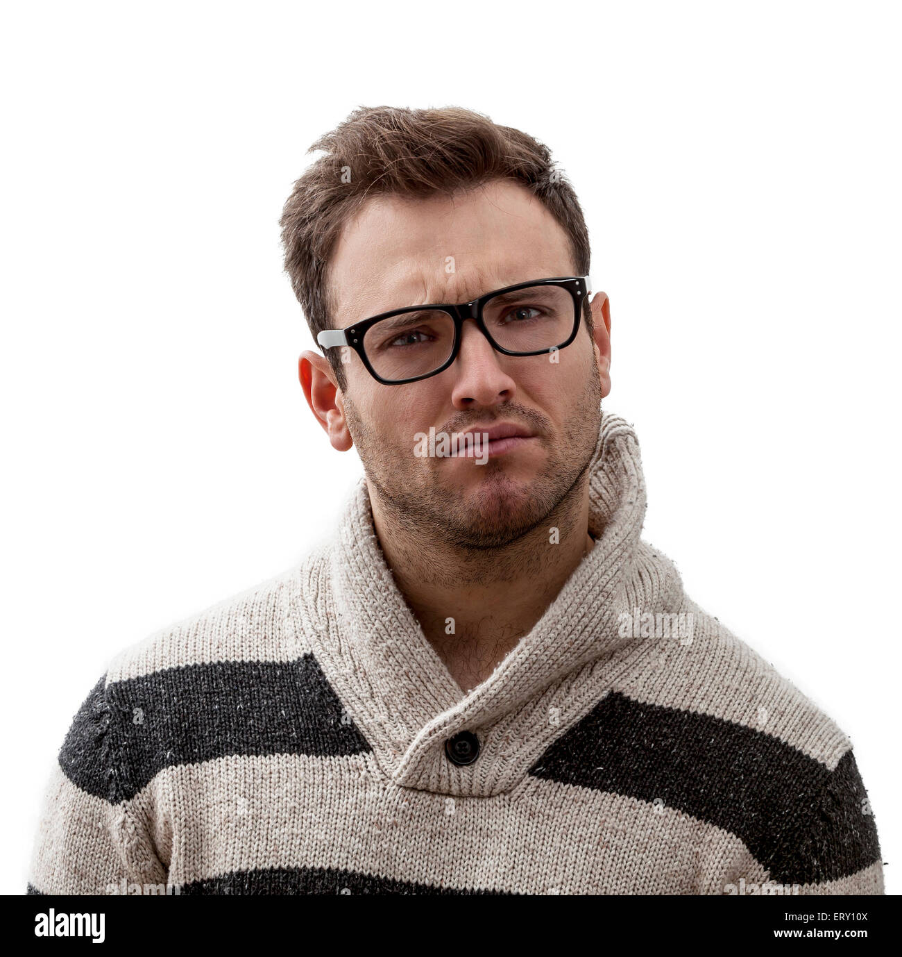Porträt von ein hübscher junger Mann mit einem verwirrten Ausdruck, vor einem weißen Hintergrund Stockfoto