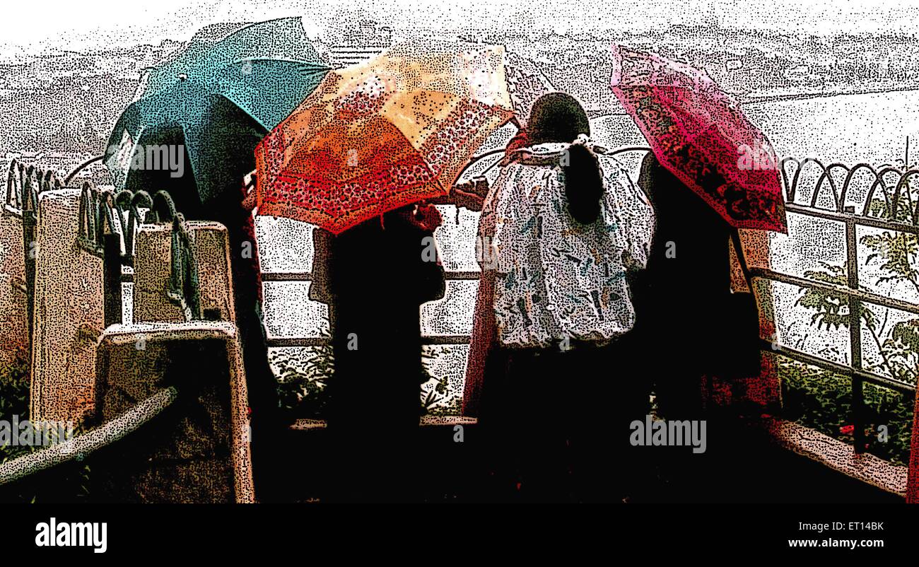 Studenten mit Regenschirm Stockfoto