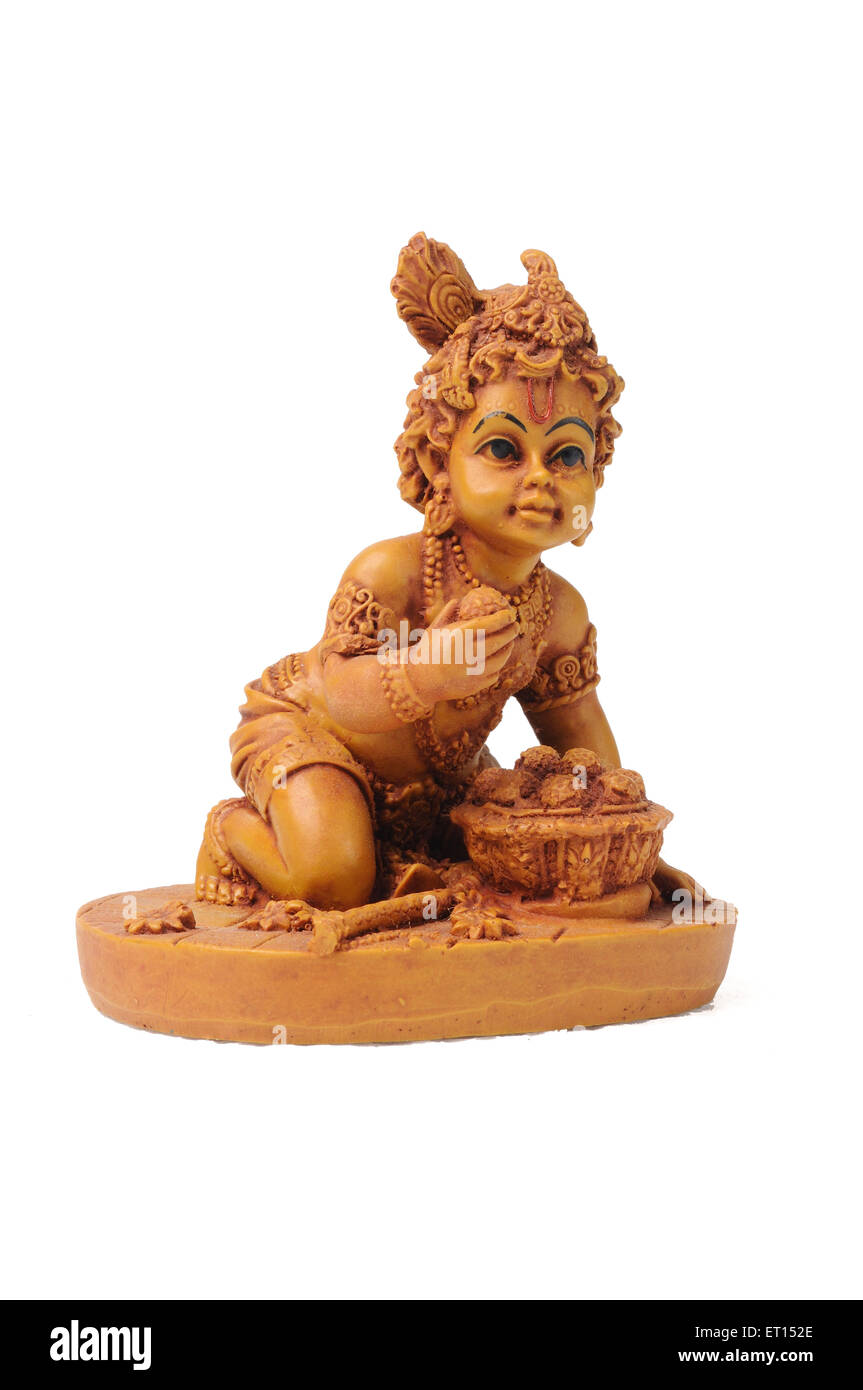 Bal Krishna, Bal Gopal, Ladoo Gopal, Baby Krishna Tonstatue auf weißem Hintergrund, Indien, Asien Stockfoto