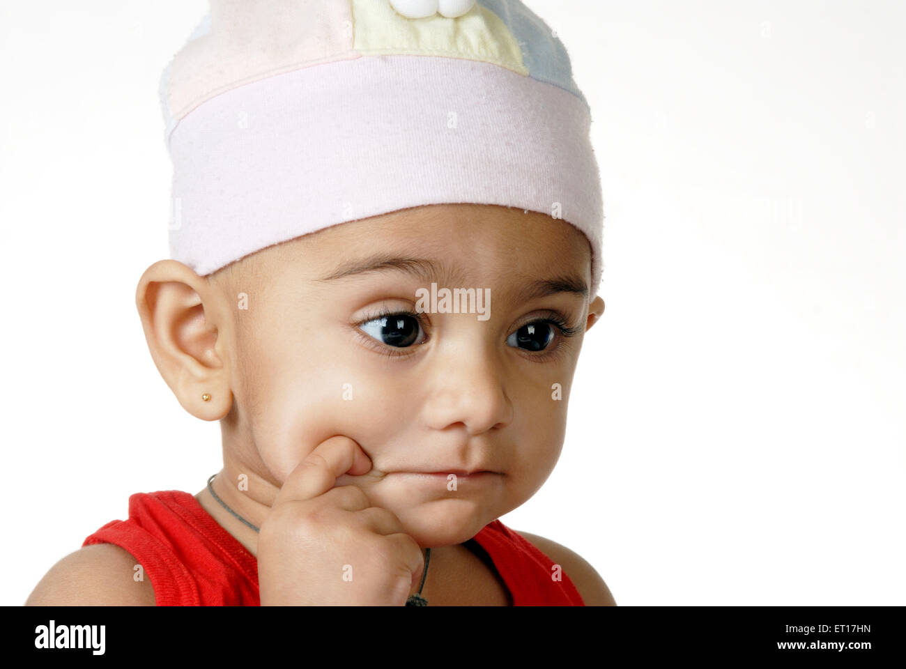 Baby Boy denken, mit dem Finger auf die Wangen HERR Nr. 512 Stockfoto