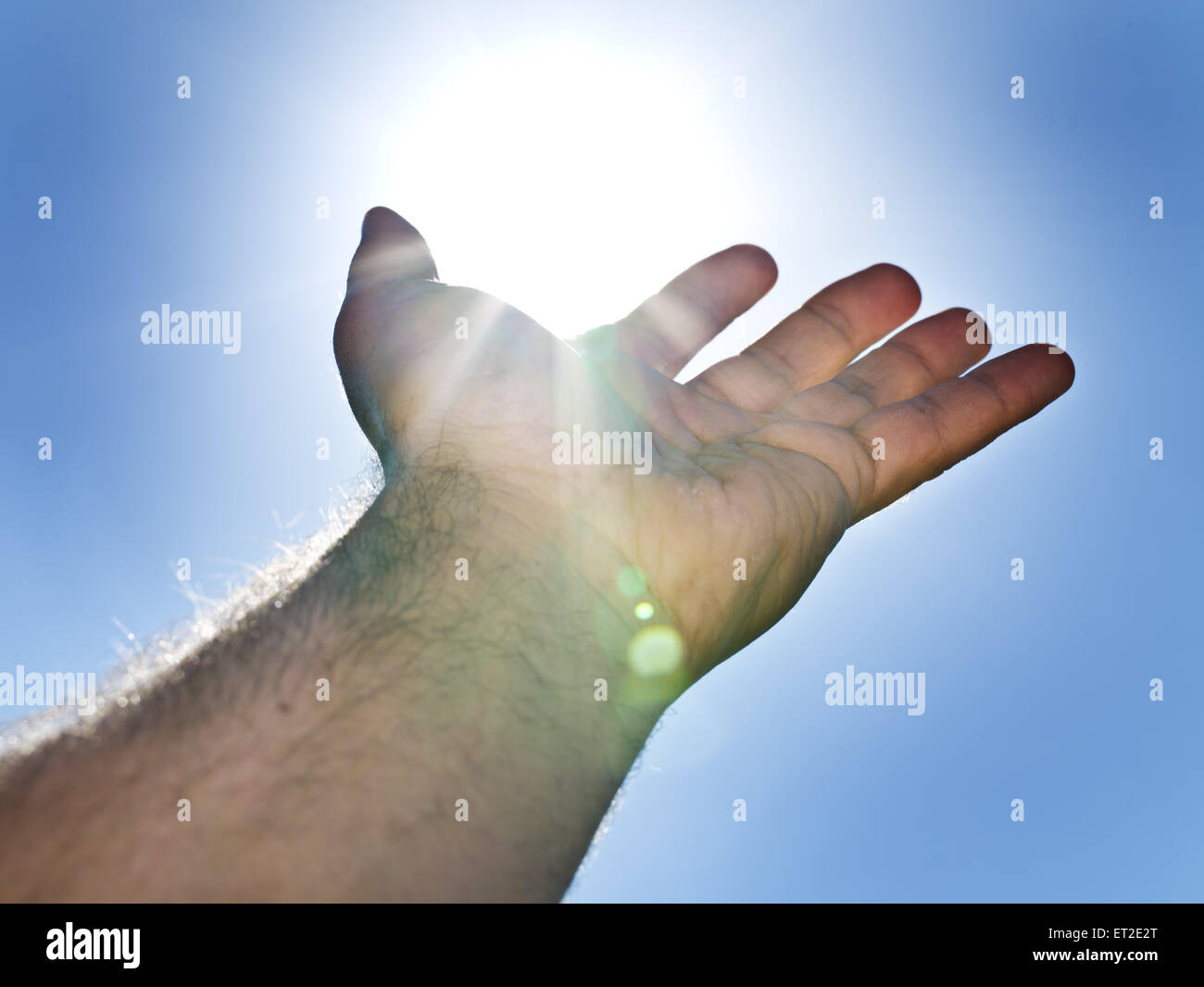 Sonne "in die Hand des Mannes". Stockfoto