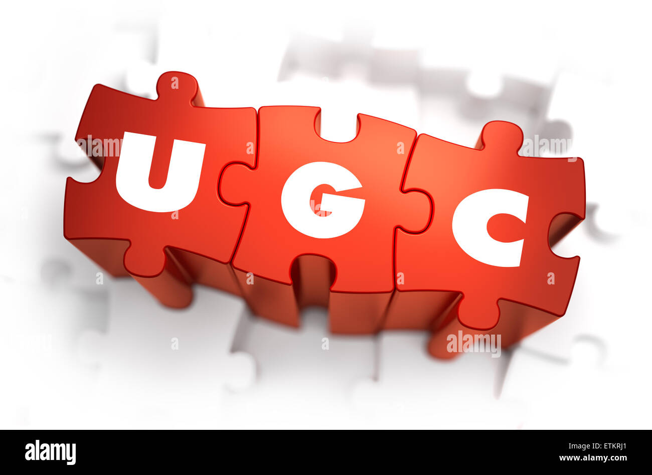 Word - UGC auf roten Puzzle. Stockfoto
