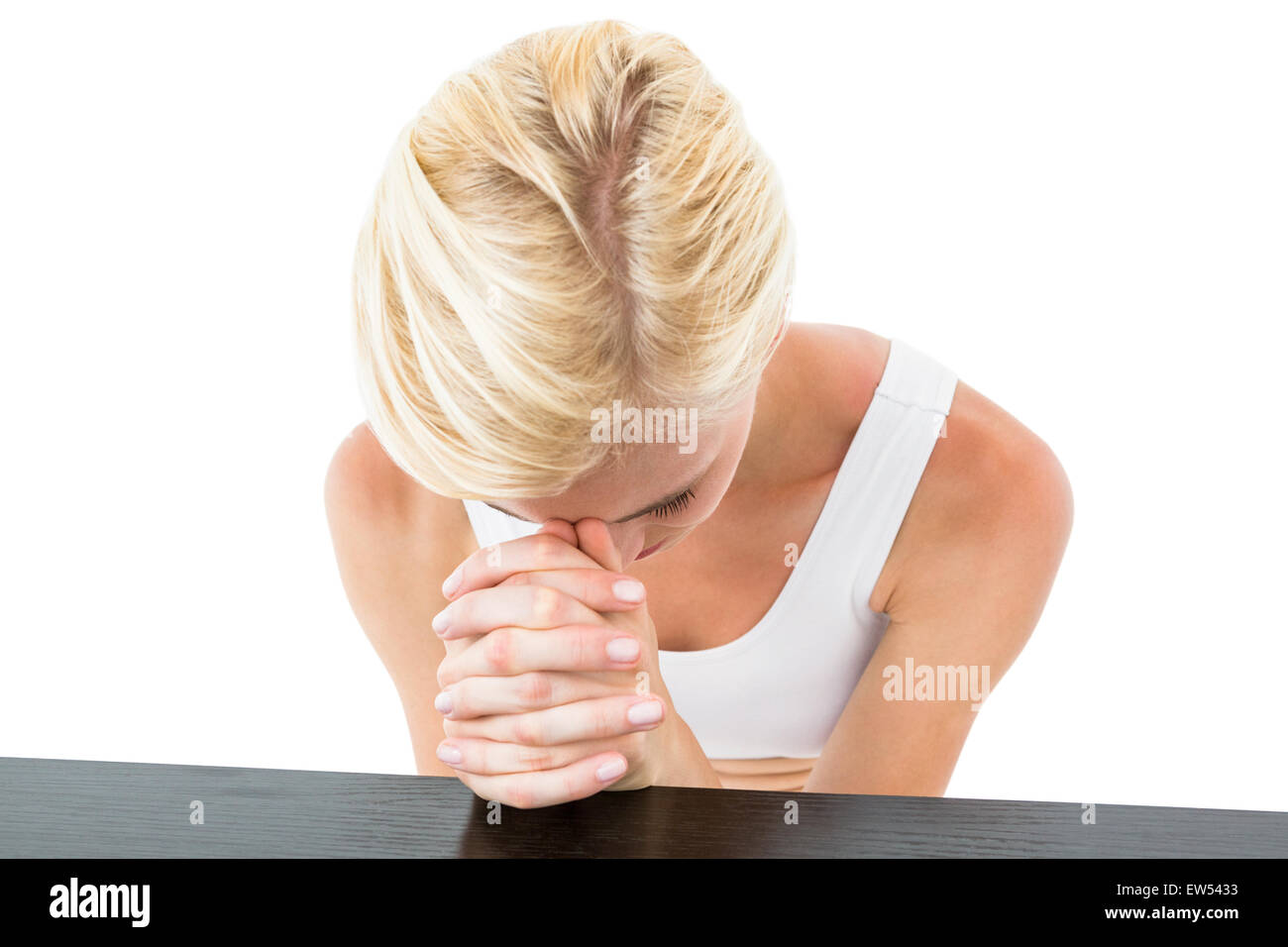 Hübsche blonde Frau beten Stockfoto