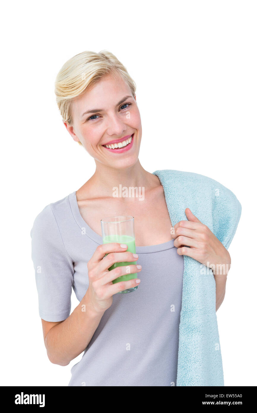 Fit Frau mit gesunden Saft und Handtuch Stockfoto