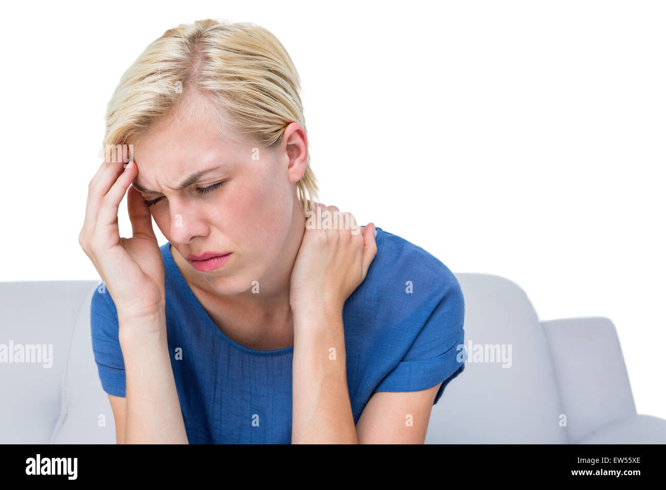 Attraktive Frau mit Kopfschmerzen Stockfoto