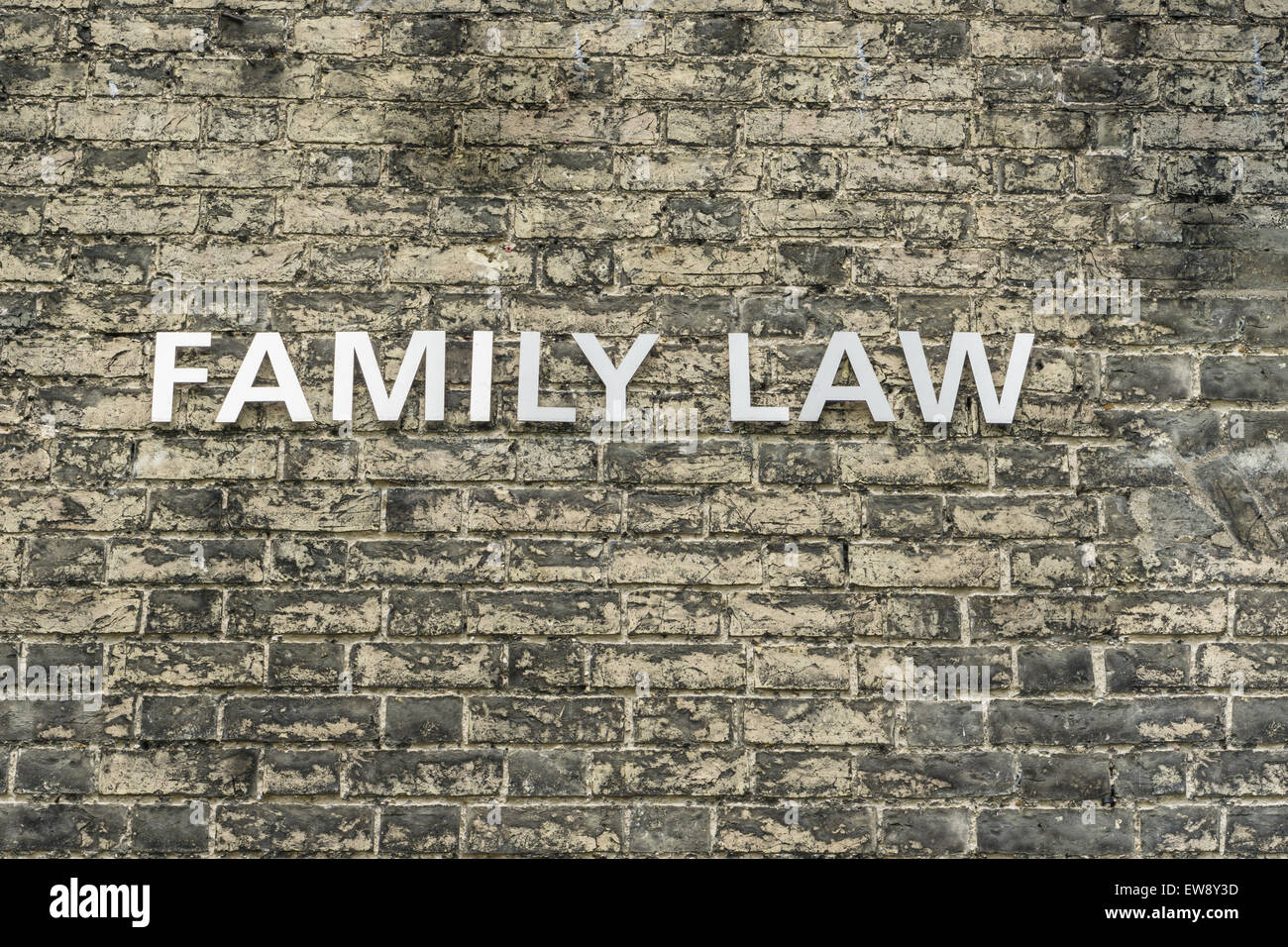 "Familienrecht" Text auf Ziegel Wand Konzeptbild Stockfoto