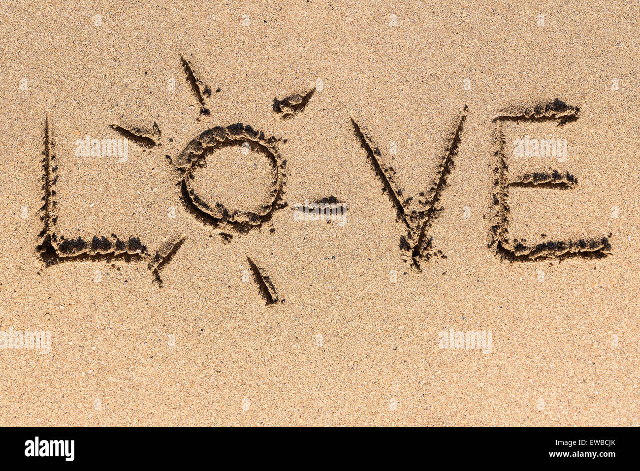 Liebe Wort am Ocean Beach Sand Stockfoto