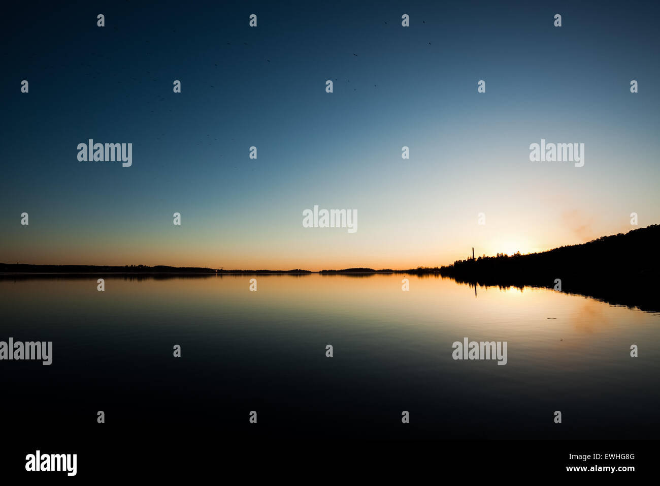 Sonnenuntergang und ruhiger See Stockfoto