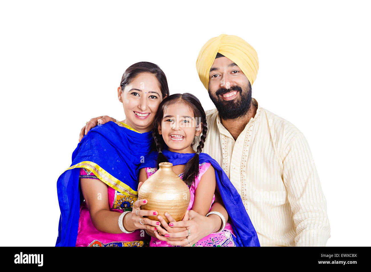 Indian Punjabi Eltern und Tochter sparen Piggy Bank Stockfoto