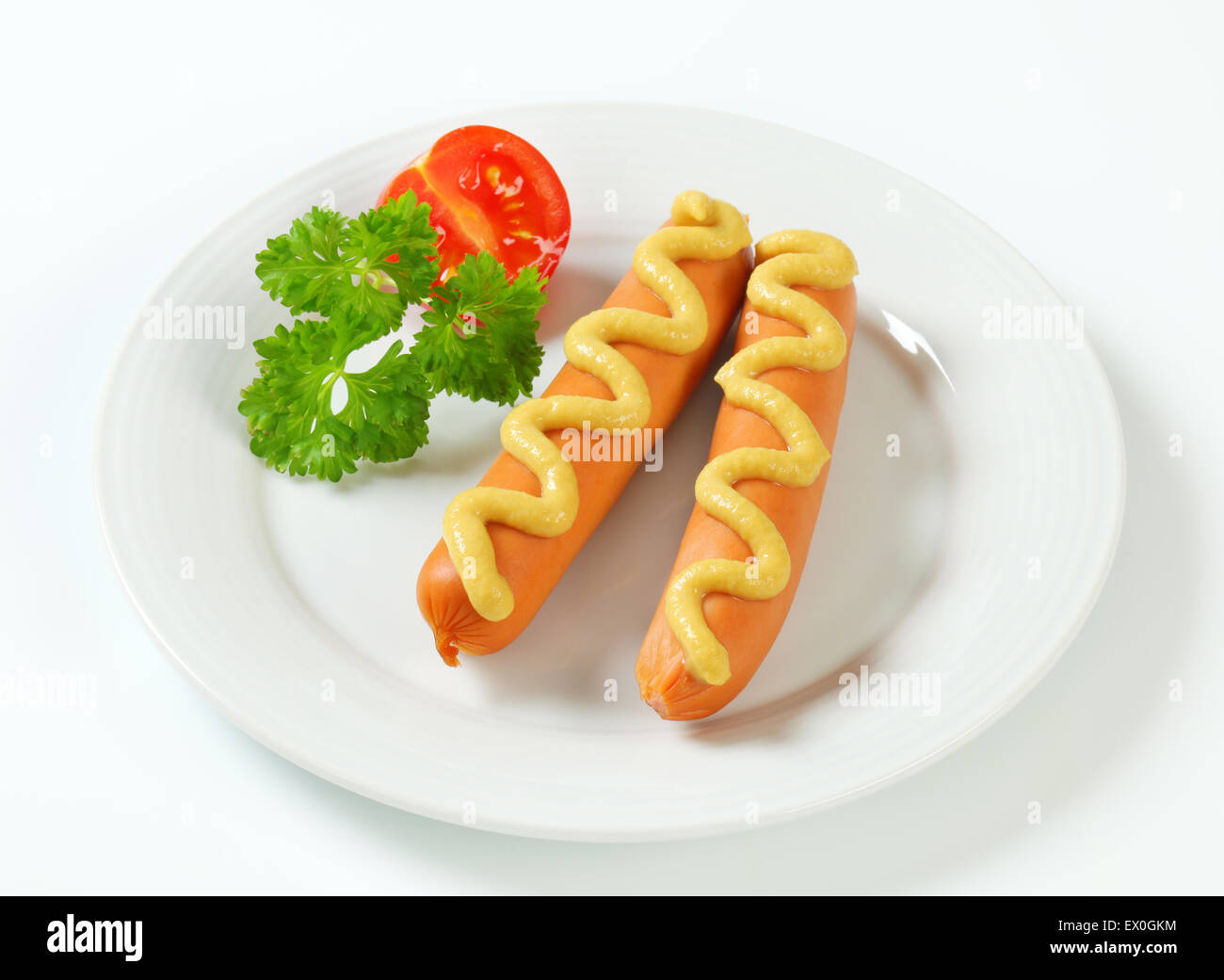Frankfurter Würstchen mit Senf-sauce Stockfoto