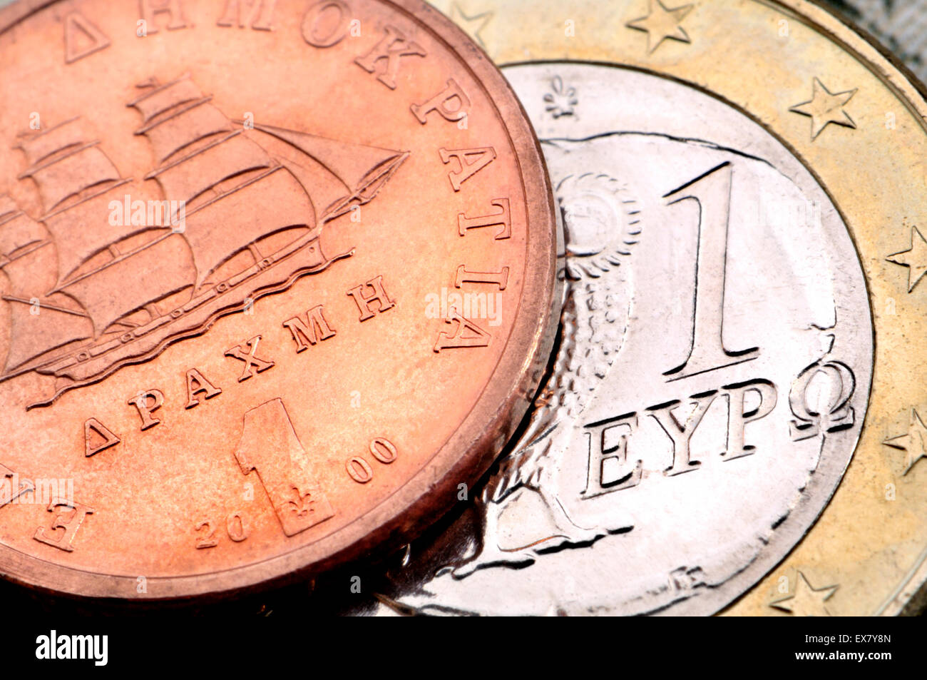 1 der griechischen Drachme und 1 Euromünzen Stockfoto