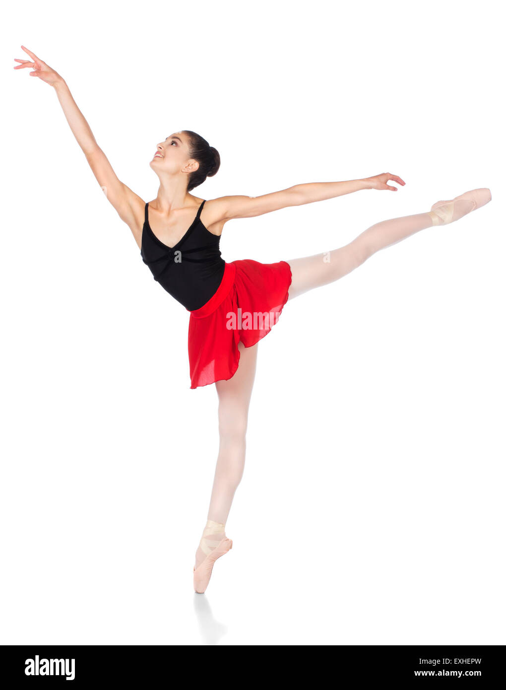 Schönen weiblichen Balletttänzer isoliert auf einem weißen Hintergrund. Ballerina trägt einen schwarzen Anzug, rosa Strümpfe, Pointe Schuh Stockfoto