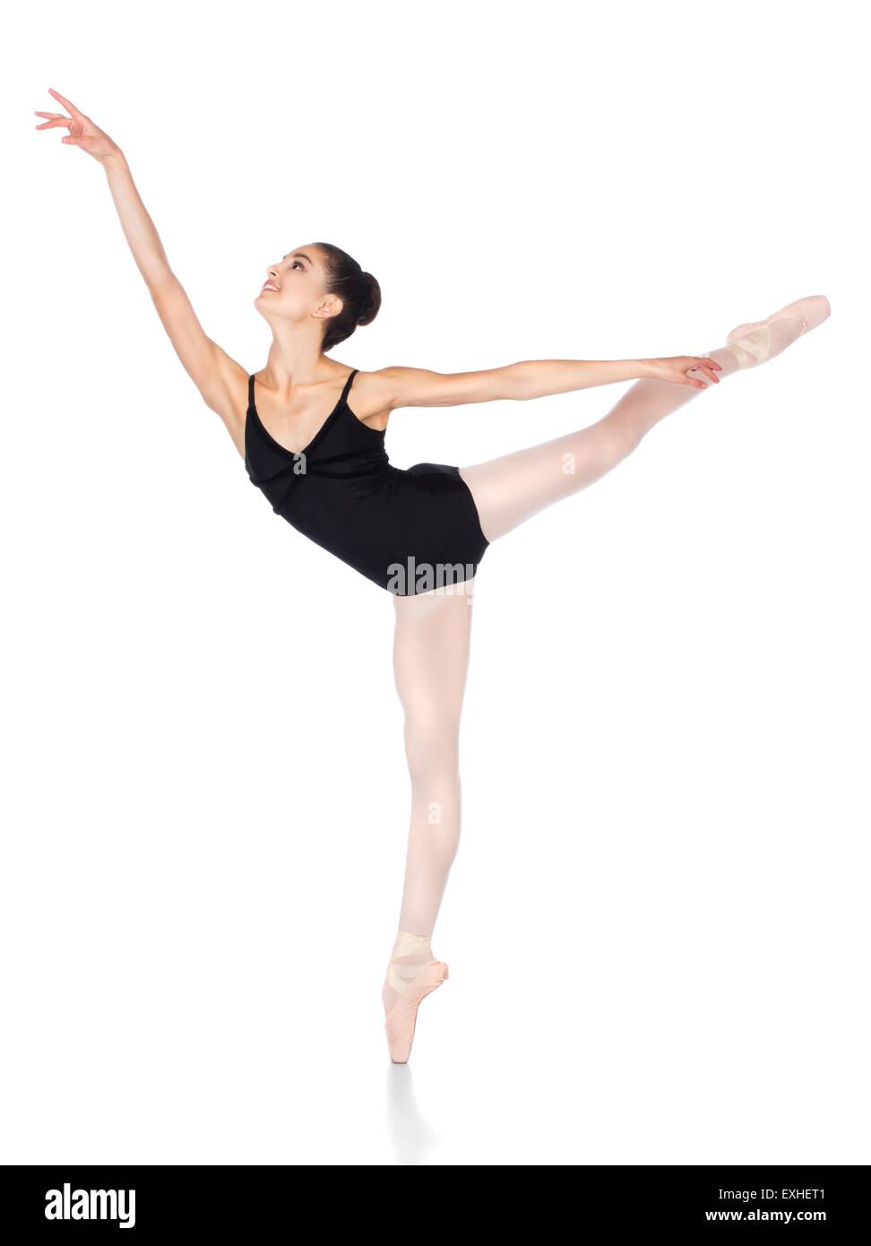 Schönen weiblichen Balletttänzer isoliert auf einem weißen Hintergrund. Ballerina trägt einen schwarzen Anzug, Spitzenschuhe und rosa Lager Stockfoto