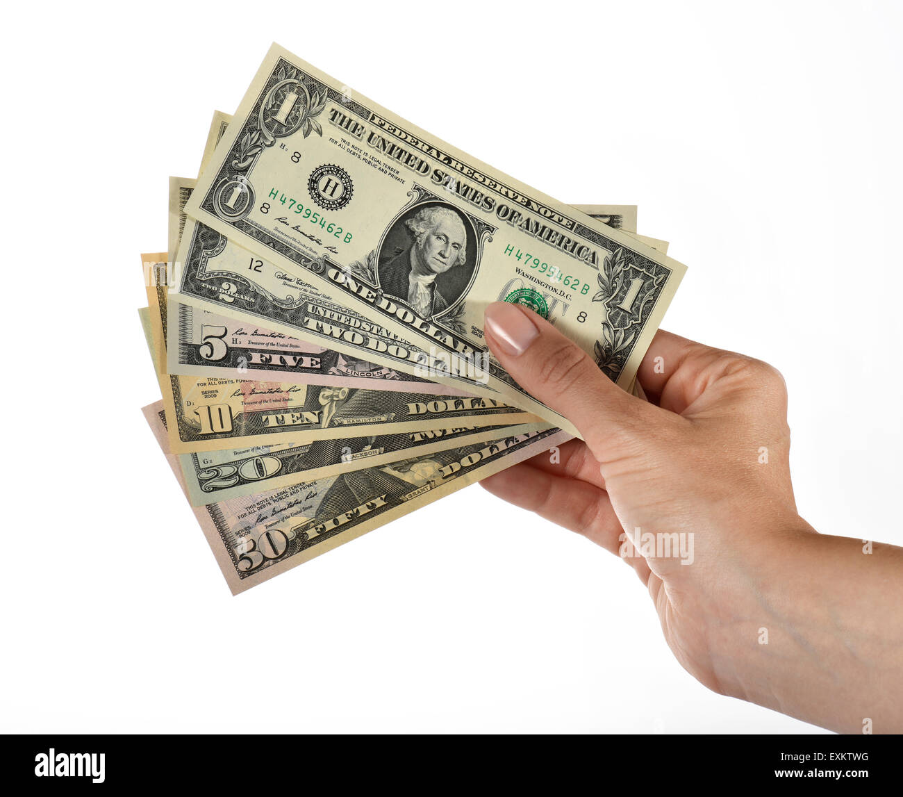 Zarte Frauenhand halten Fan von verschiedenen US-Dollar-Noten Stockfoto