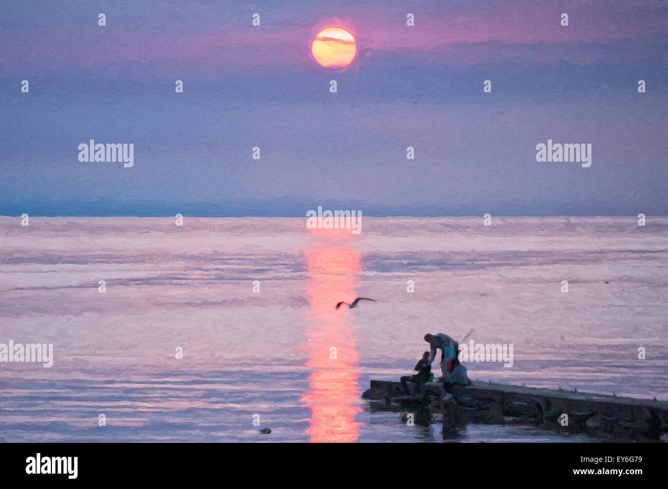 Ein digitales Bild einer jungen Familie packen ihre Fanggeräte inmitten einer spektakulären Sonnenuntergang in Torekov in Schweden. Stockfoto