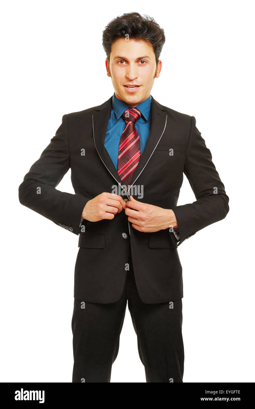 Geschäftsmann, die Schließen Schaltfläche Anzug mit seinen Händen Stockfoto