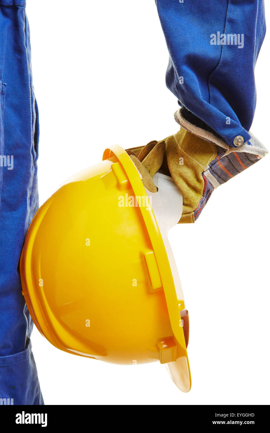 Hand des Arbeiters mit gelben Bauarbeiterhelm Helm Stockfoto