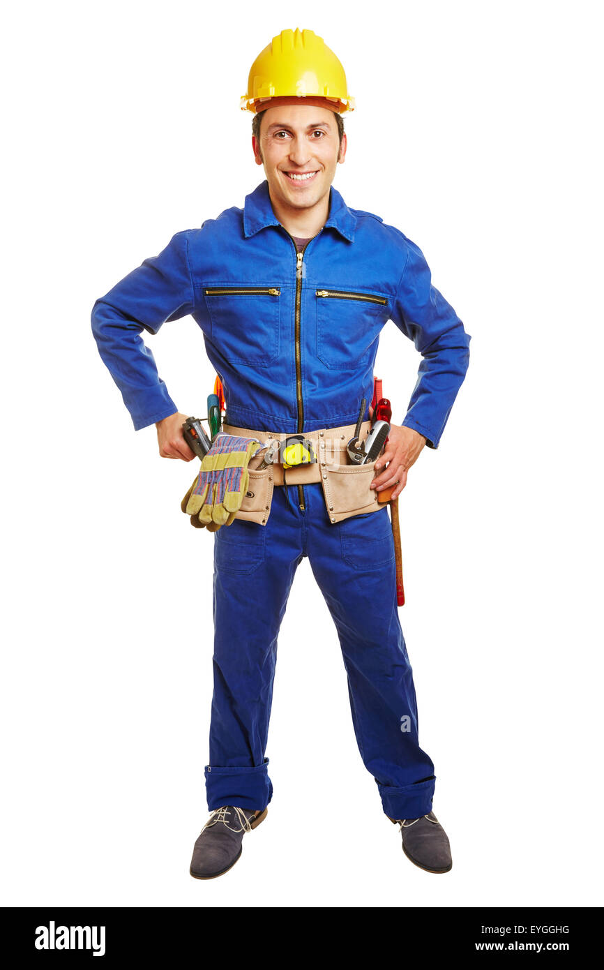 Lächelnde Arbeiter mit blauen Helm und insgesamt und ein Werkzeuggürtel Stockfoto