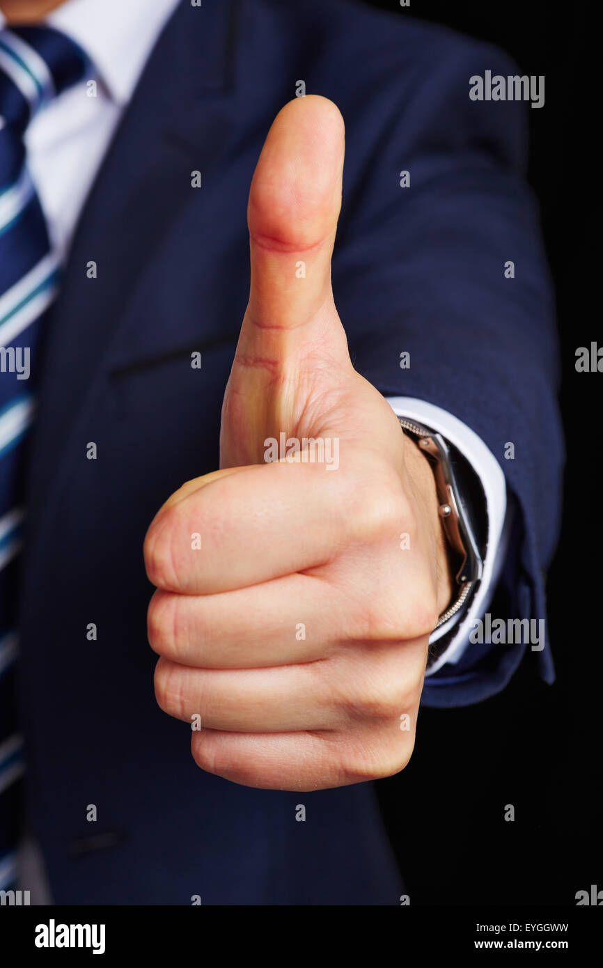 Daumen hoch Symbol von Business Manager auf einem dunklen Hintergrund Stockfoto